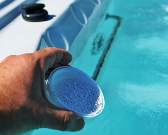 image of adding hot tub chemicals