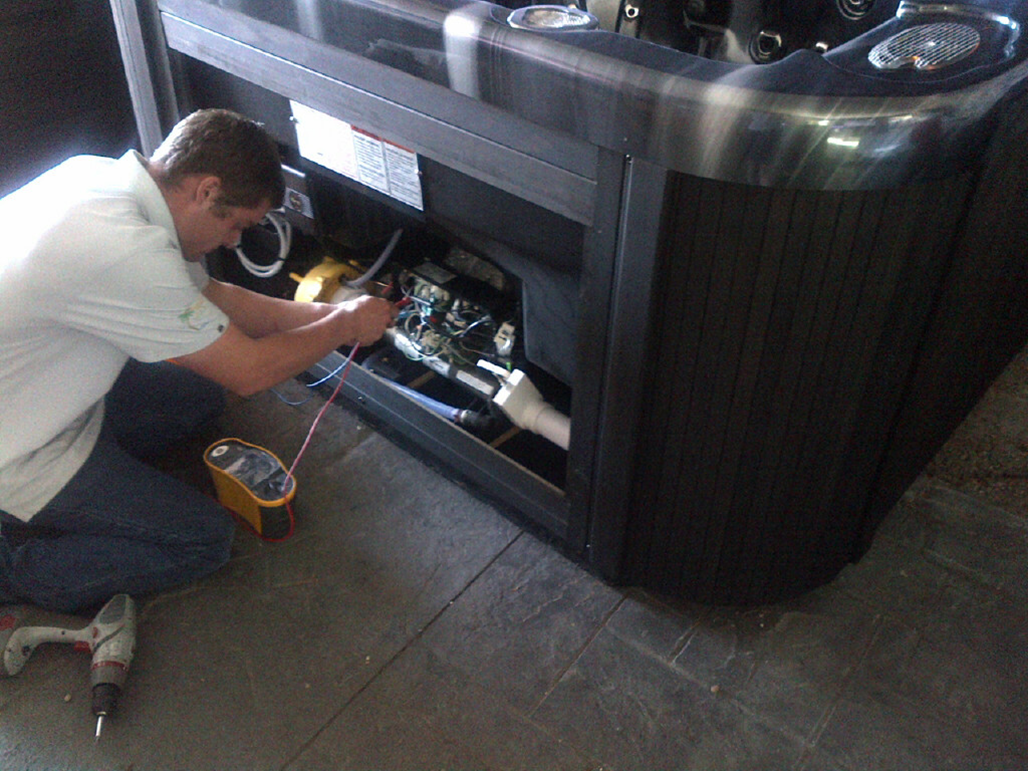 image of checking condition of a second hand hot tub