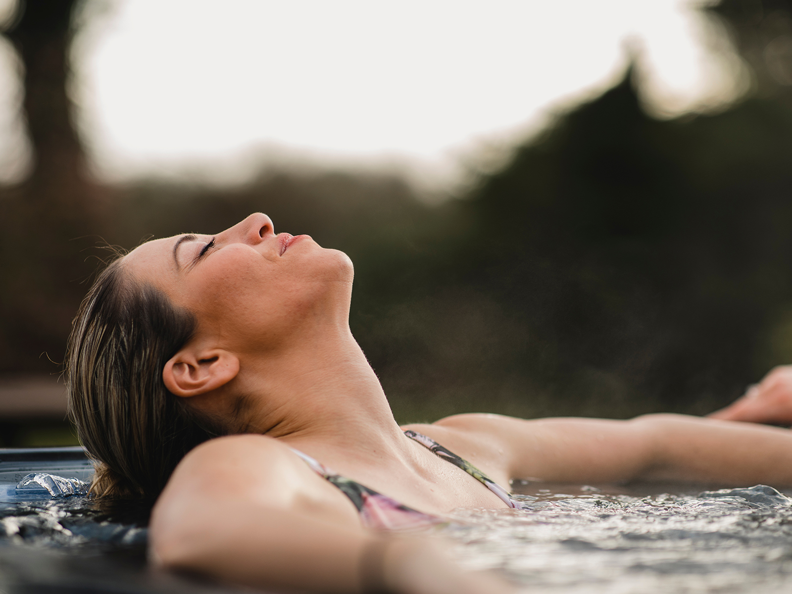 person relaxing in hot tub