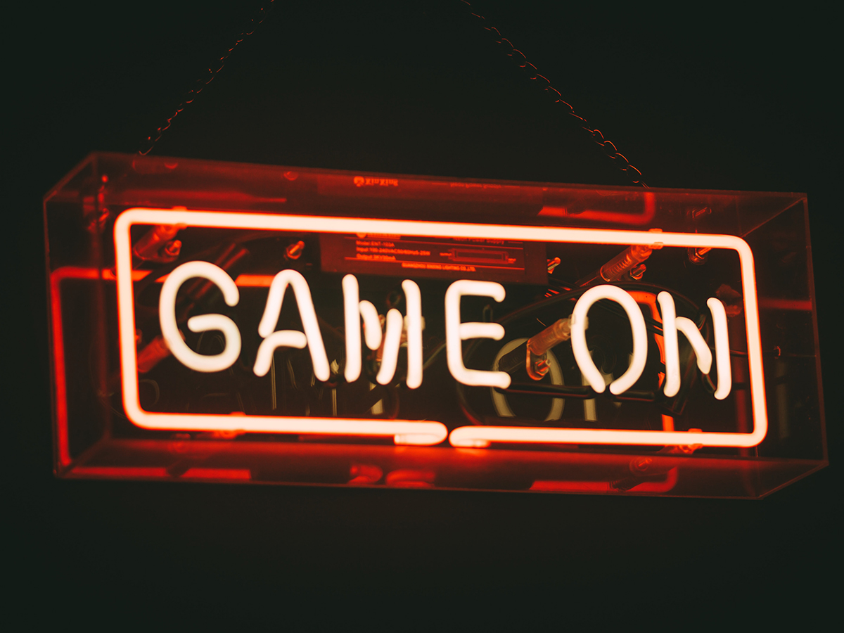 Neon sign that says 'game on'