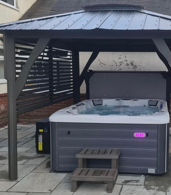 Here is a heat pump fitted to a hot tub with a gazebo